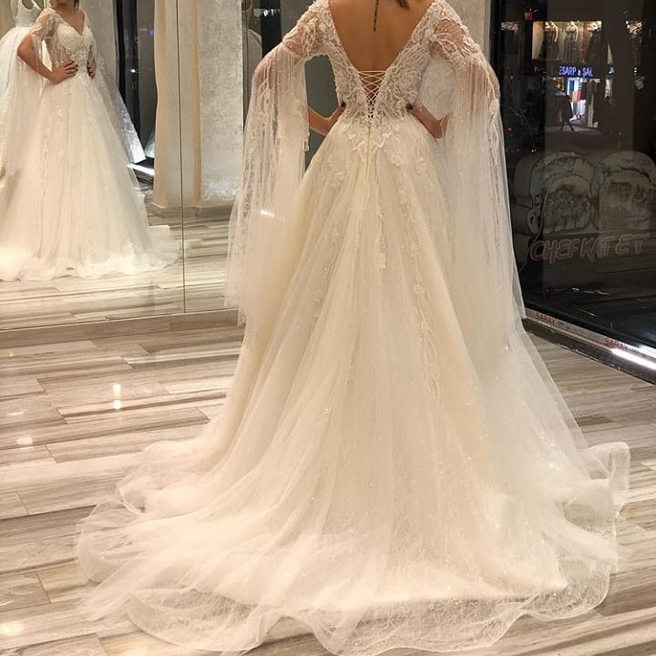 Luxurious A-Line Deep V-neck Short Sleeves Backless Floor-length Wedding Dress with Appliques Lace and Pearls