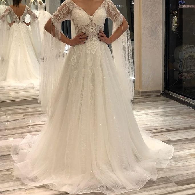 Luxurious A-Line Deep V-neck Short Sleeves Backless Floor-length Wedding Dress with Appliques Lace and Pearls