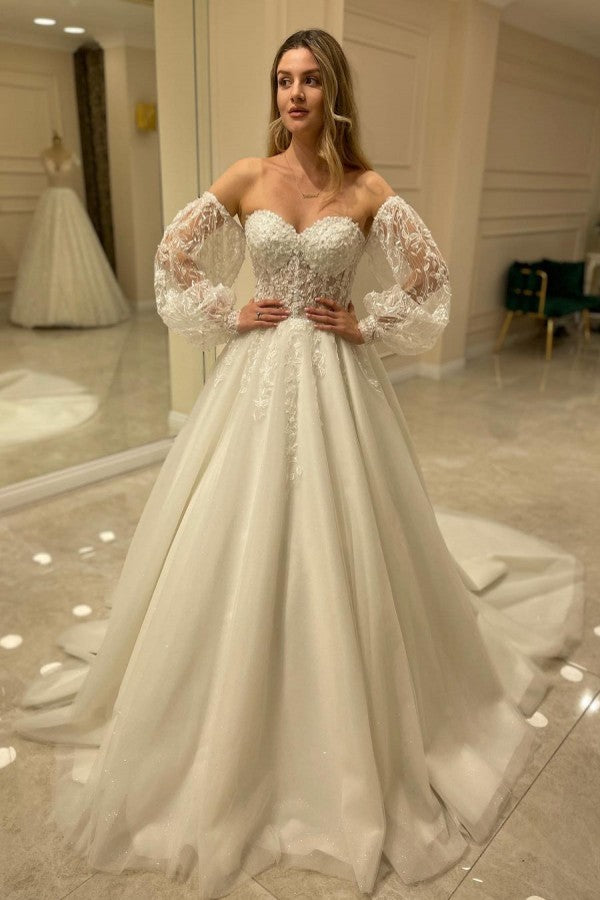 Elegant Sweetheart A-Line Wedding Dress with Appliques Lace and Backless Train