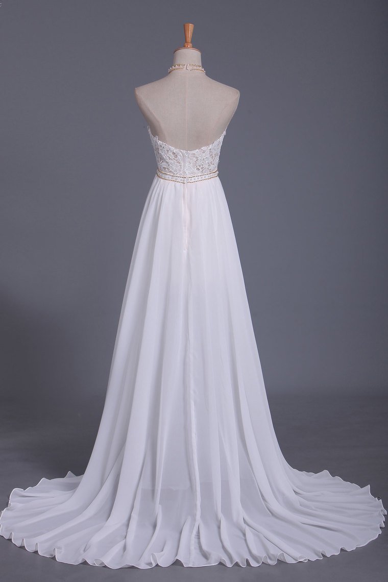 Chic Halter Backless Chiffon A-Line Floor-length Wedding Dress With Ruffles and Pearl Lace